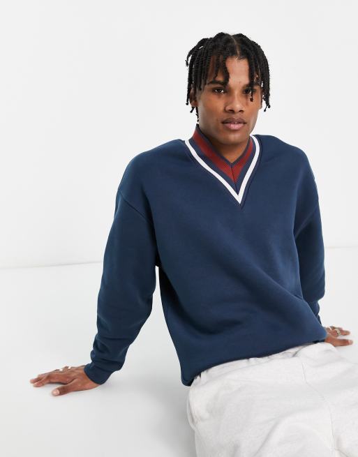 ASOS DESIGN oversized sweatshirt with v neck tipping in dark blue