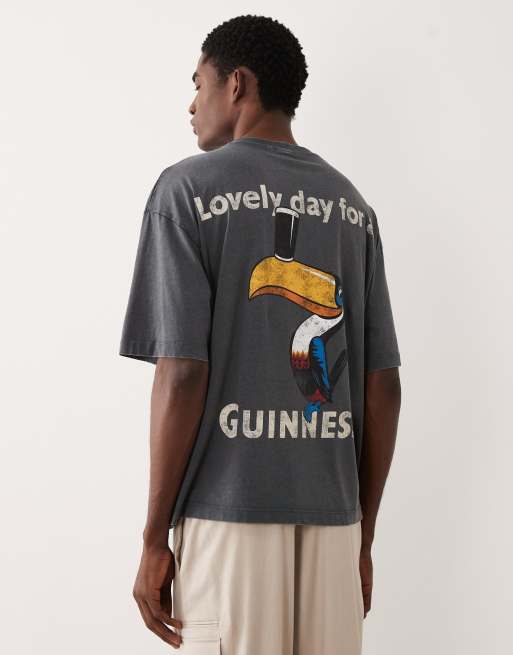 ASOS DESIGN - Oversized T-shirt i forvasket sort med Guinness-print