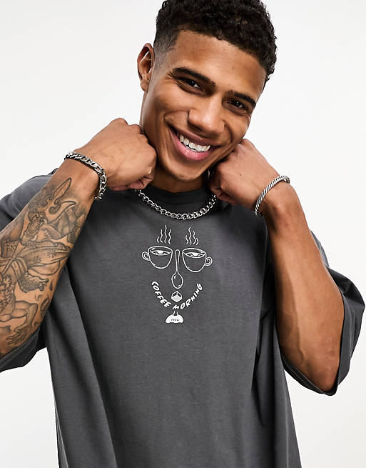 ASOS DESIGN oversized t-shirt in black with line drawing face chest ...