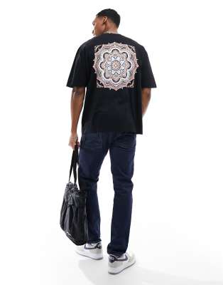 ASOS DESIGN oversized t-shirt in black with paisley back