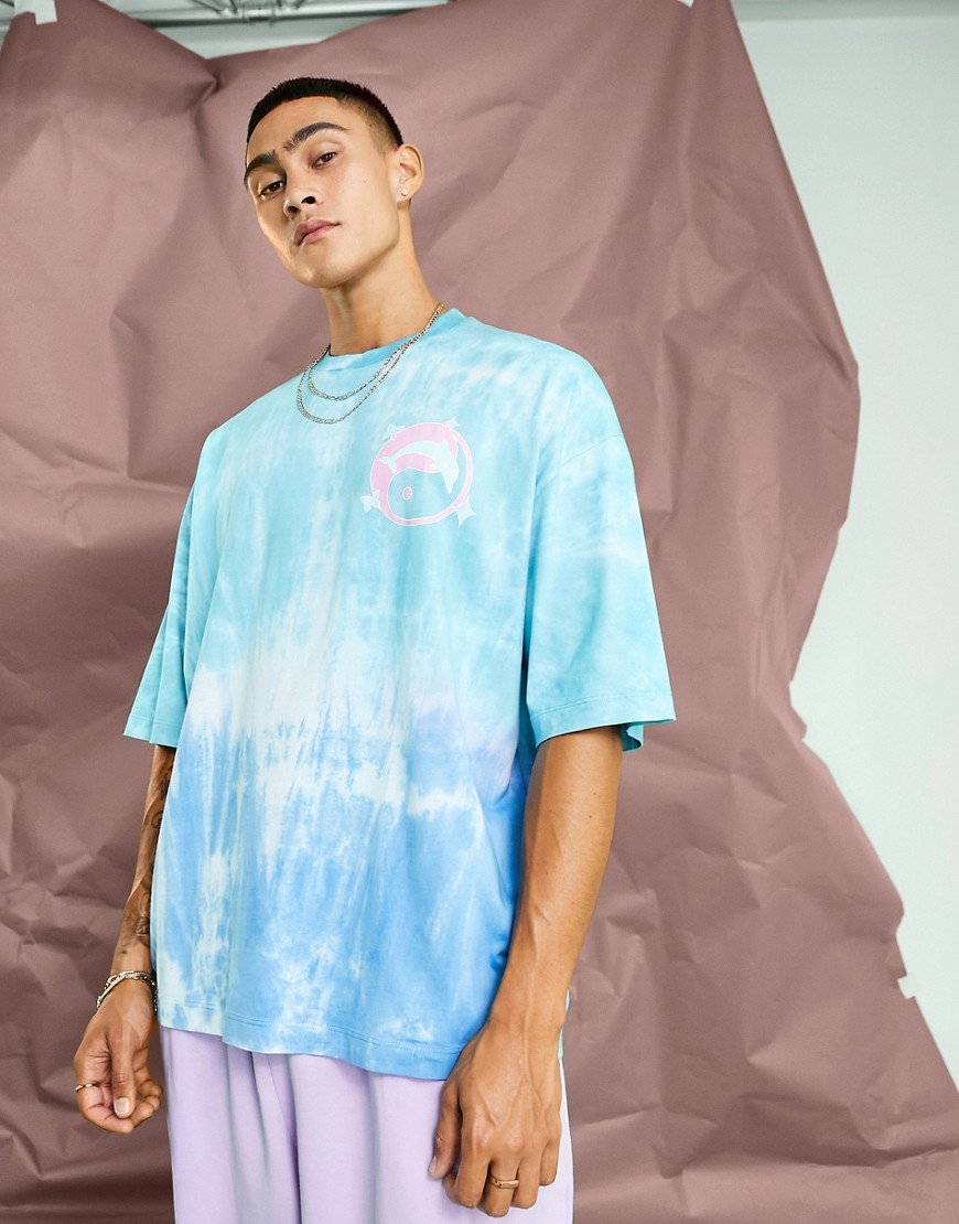 ASOS DESIGN oversized t-shirt in blue tie dye with skate chest print