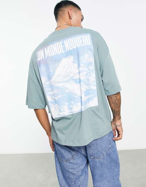 ASOS DESIGN oversized T-shirt in blue with photographic mountains back print