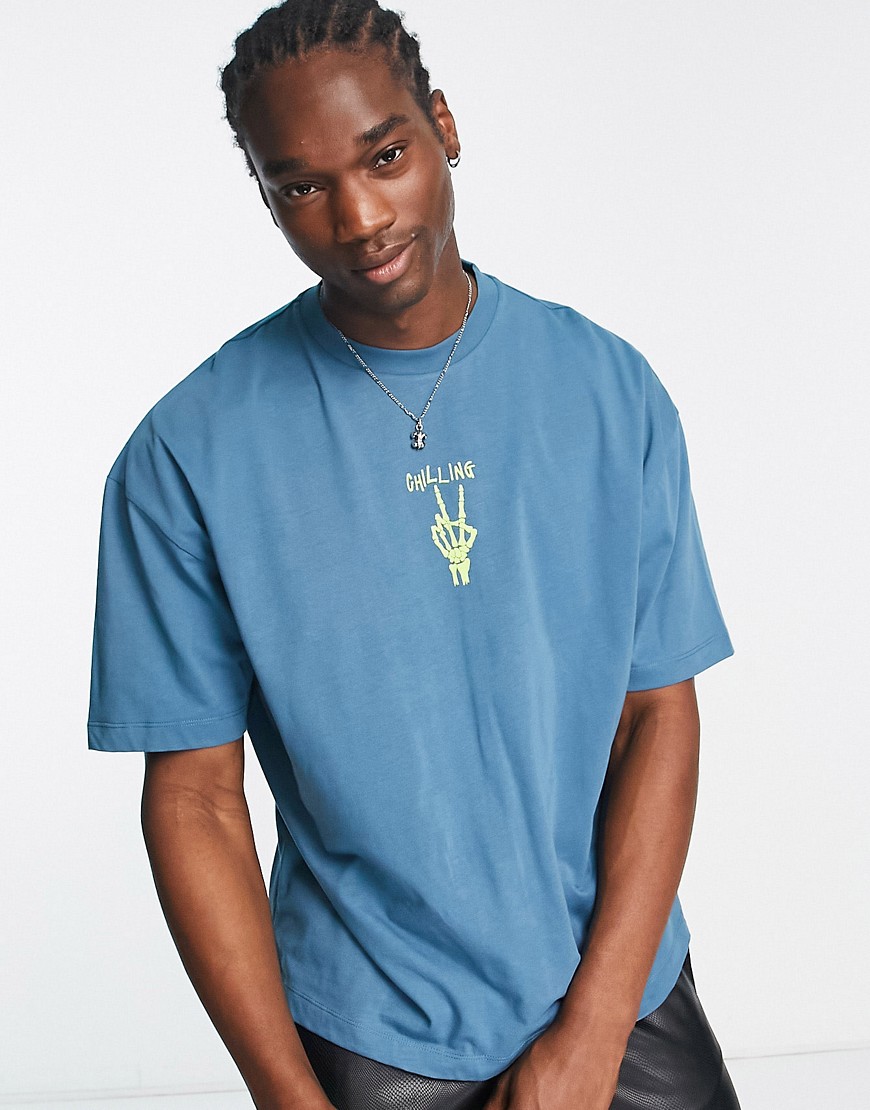 ASOS DESIGN oversized T-shirt in blue with skeleton hand chest print