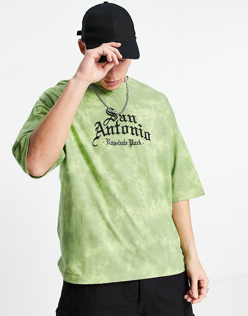 ASOS DESIGN oversized t-shirt in green bleach wash with city chest print