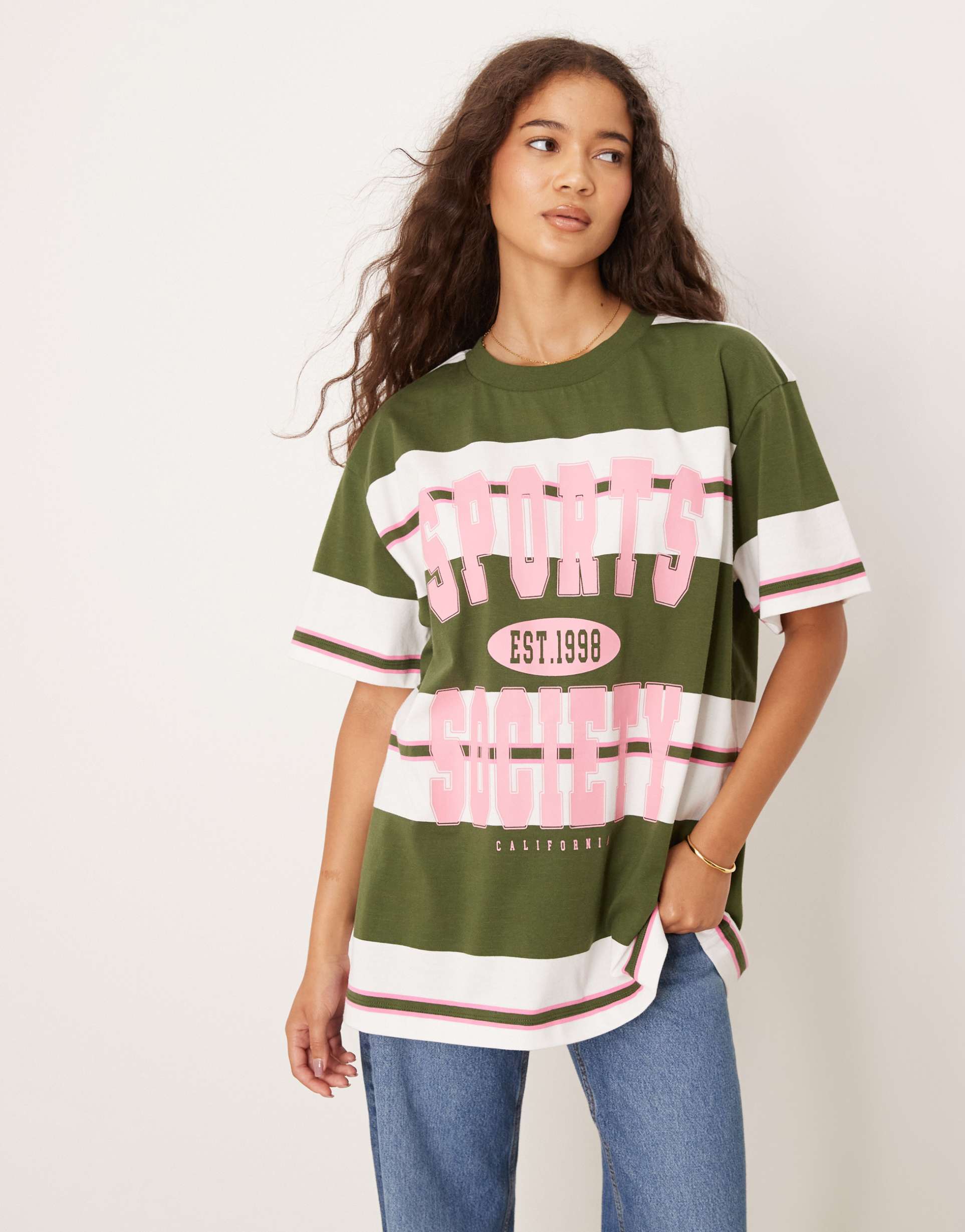 asos design oversized t-shirt in green stripes with sports society graphic
