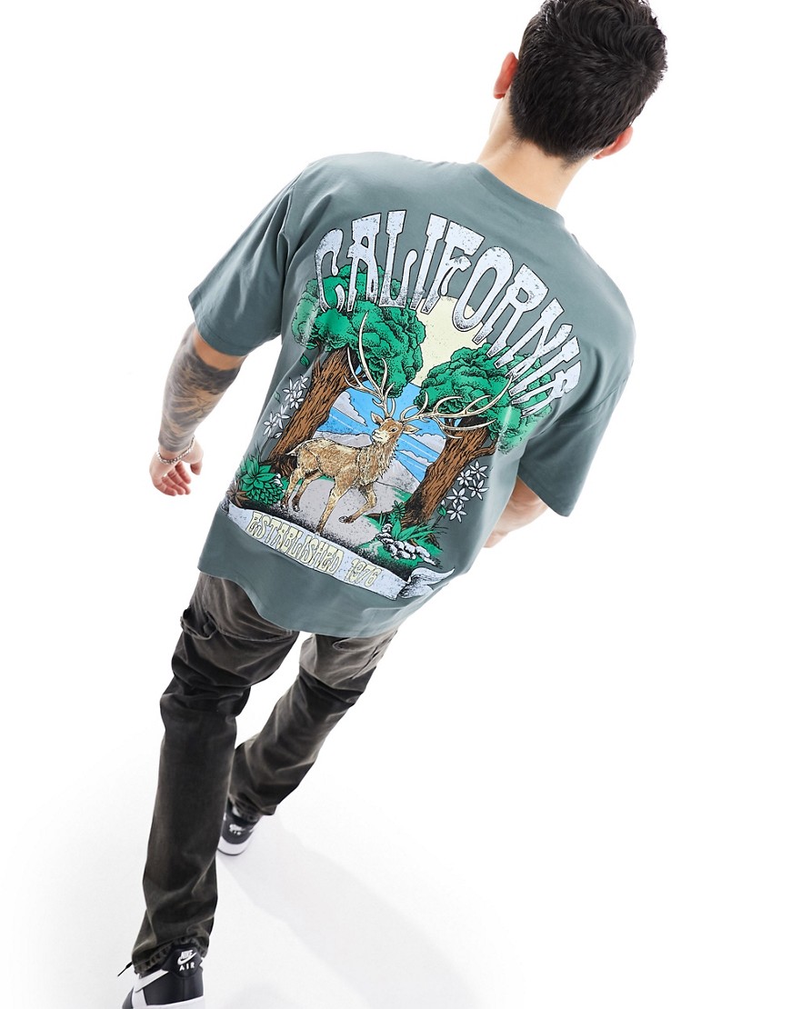 ASOS DESIGN oversized t-shirt in green with back outdoors cartoon print