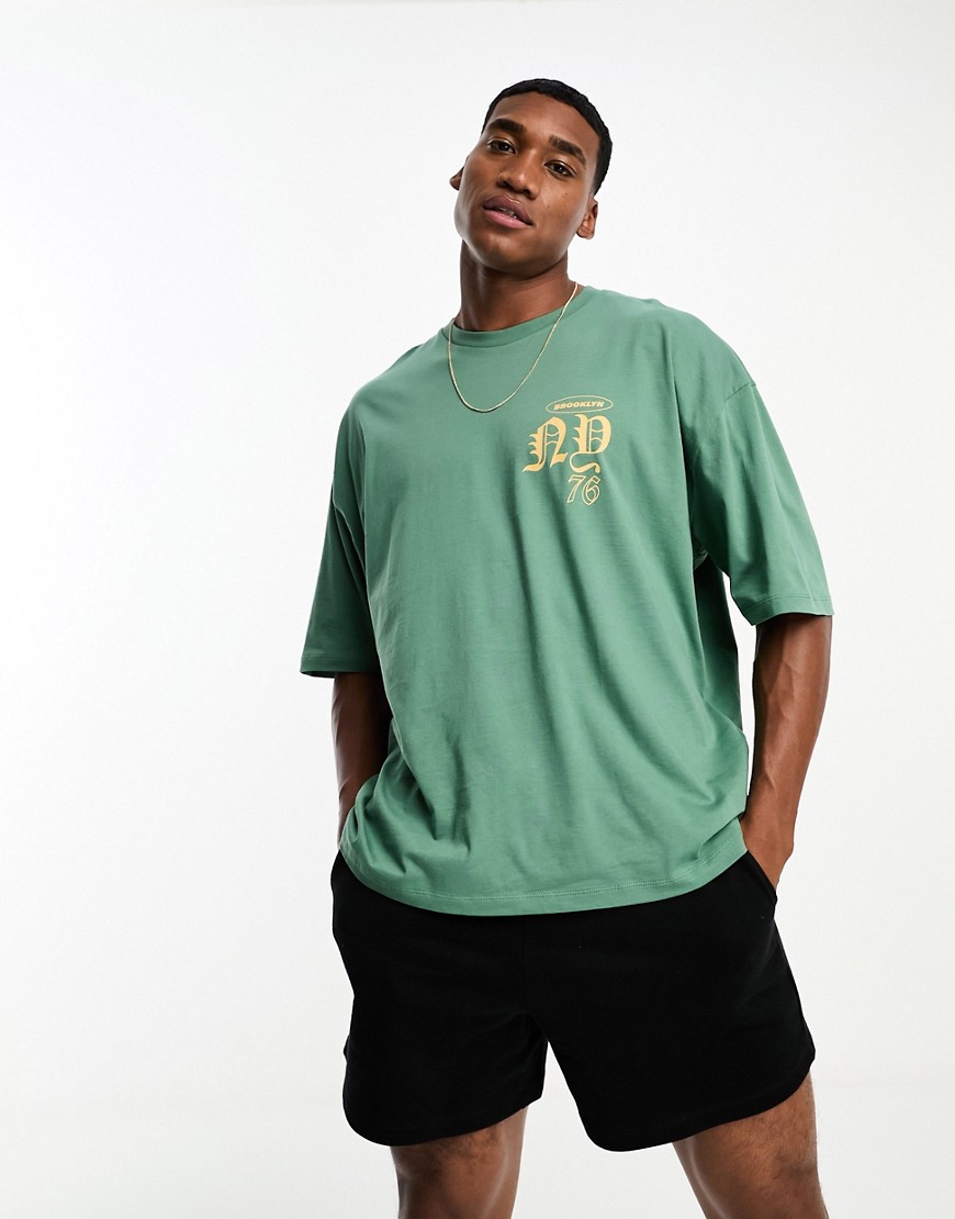 ASOS DESIGN oversized t-shirt in green with gothic text chest print