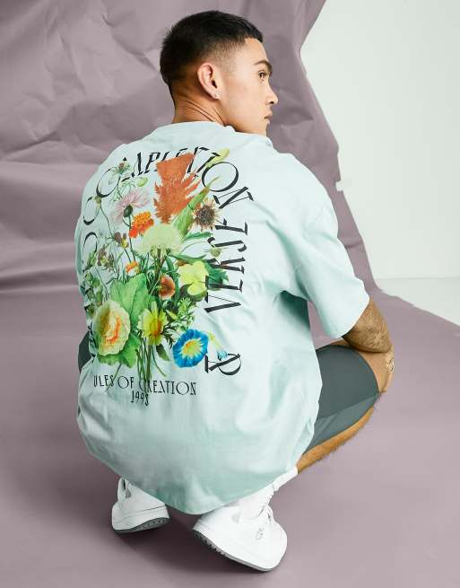 ASOS DESIGN - Oversized T-shirt in groen met bloemenprint op de achterkant