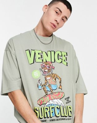 ASOS DESIGN oversized t-shirt in khaki with cartoon surf front & back puff print