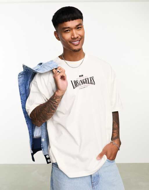 ASOS DESIGN oversized t-shirt in off white with city chest print