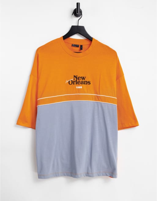 ASOS DESIGN oversized T-shirt in orange and grey colour-block with New Orleans city print