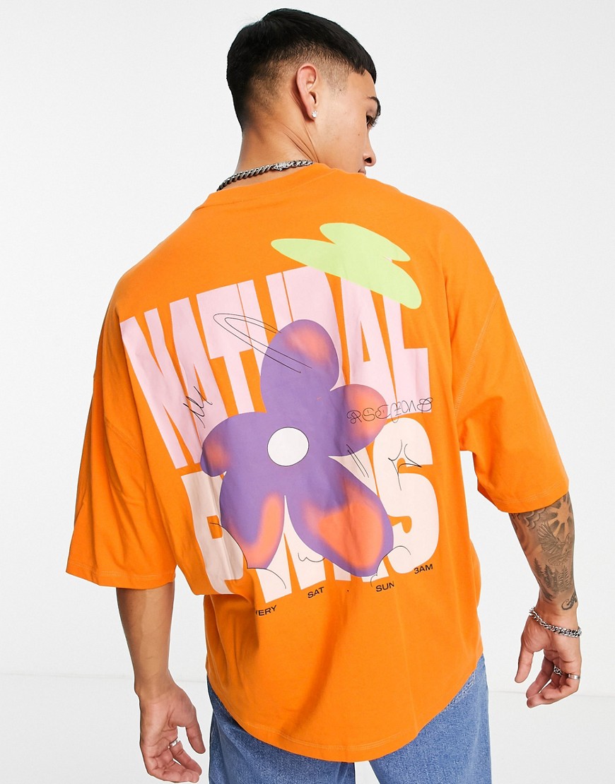 ASOS DESIGN oversized T-shirt in orange organic cotton with flower back print