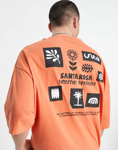 ASOS DESIGN oversized T-shirt in orange with cartoon front & back puff print - view 1