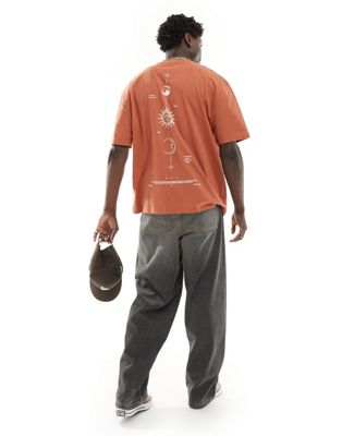 ASOS DESIGN oversized t-shirt in orange with celestial back print