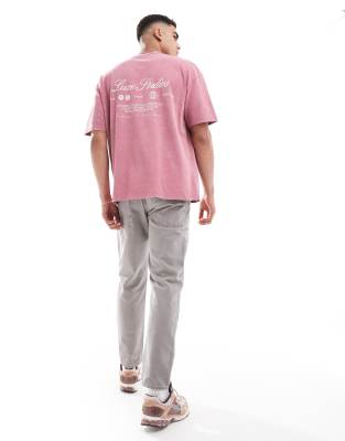 ASOS DESIGN oversized t-shirt in washed pink with sport back print