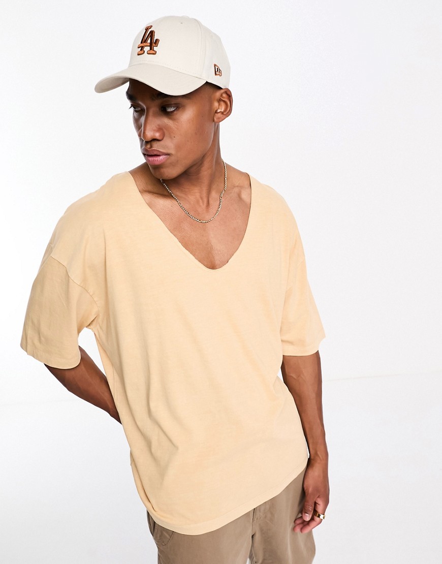 ASOS DESIGN oversized t-shirt in washed yellow with deep V-Neutral