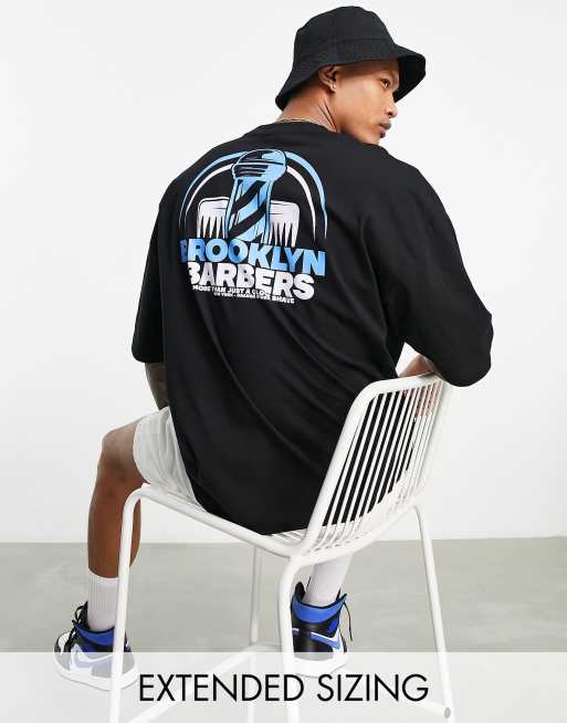 ASOS DESIGN - Oversized T-shirt in zwart met barber shop-print op de achterkant