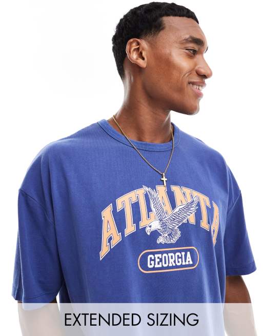 ASOS DESIGN - Oversized T-shirt med byprint fortil i blå vask