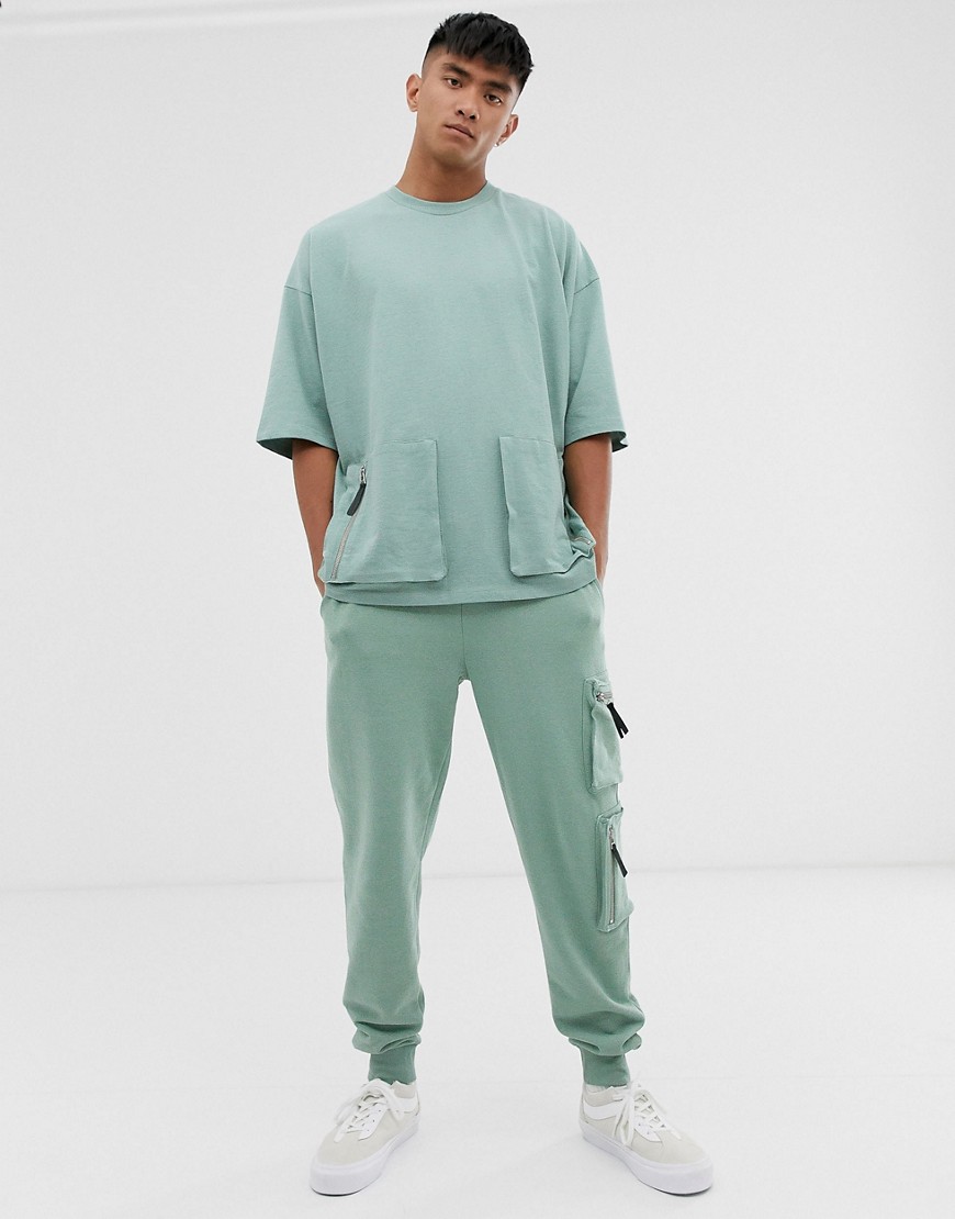 ASOS DESIGN - Oversized T-shirt met halflange mouwen van zware jersey met utility-zakken, combi-set-Groen