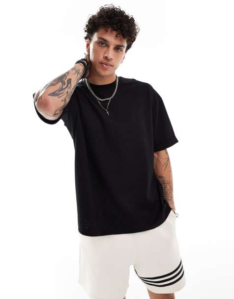 ASOS DESIGN - Oversized T-shirt met omgeslagen mouwen en textuur in zwart - view 1