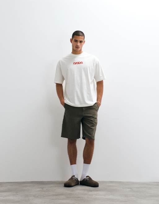 ASOS DESIGN - Oversized T-shirt met straatprint in crème, 2 van 5