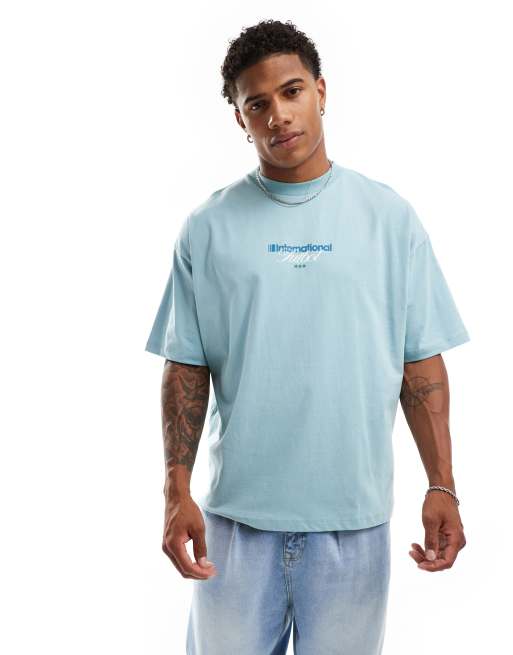ASOS DESIGN - Oversized T-shirt met voetbalprint op de achterkant in steenblauw, 2 van 4