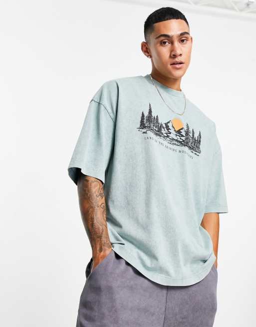 ASOS DESIGN - Oversized T-shirt van zware kwaliteit met lanschapsprint op de borst in verwassen blauw
