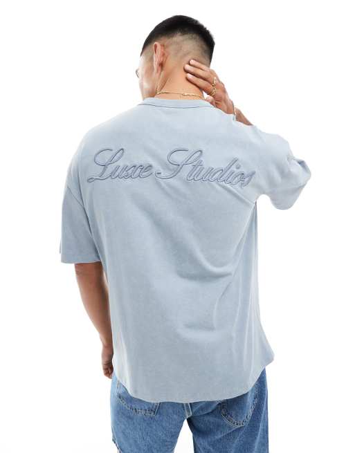 ASOS DESIGN - Oversized T-shirt van zware stof met geborduurde tekstprint op de achterkant in blauw met wassing