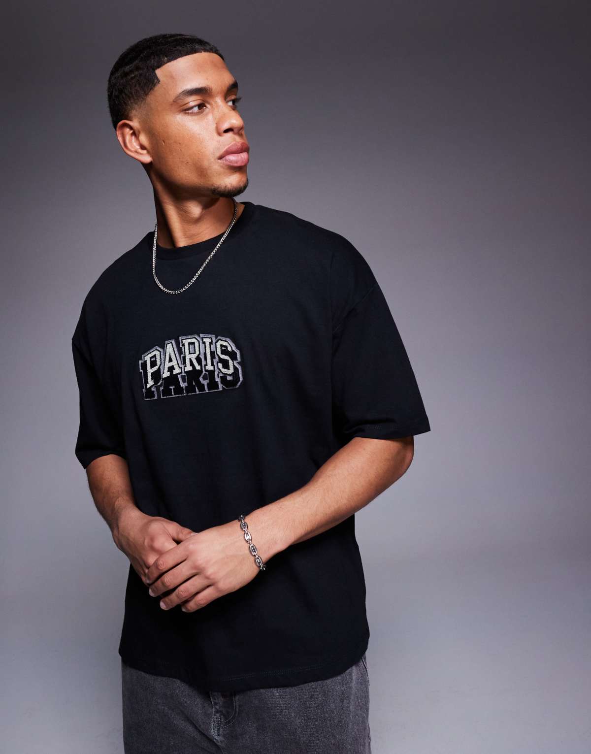 ASOS DESIGN oversized t-shirt with city chest embroidery in black