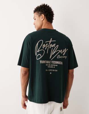 ASOS DESIGN oversized t-shirt with city text graphics in dark green