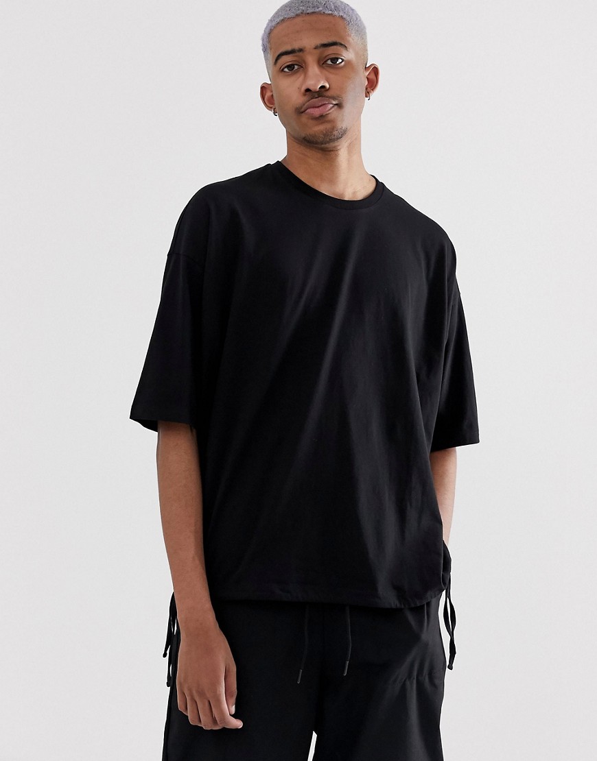 ASOS DESIGN oversized t-shirt with drawstring hem in black