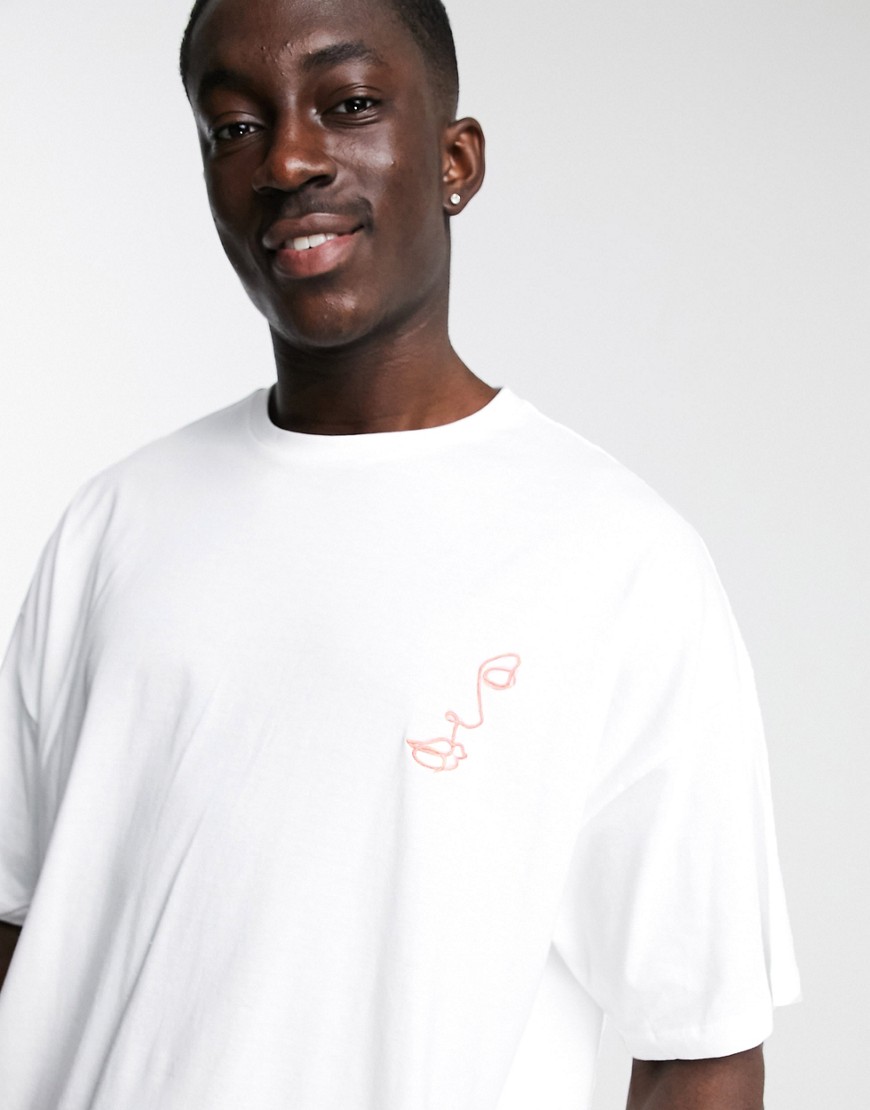 ASOS DESIGN oversized t-shirt with face line chest embroidery in white
