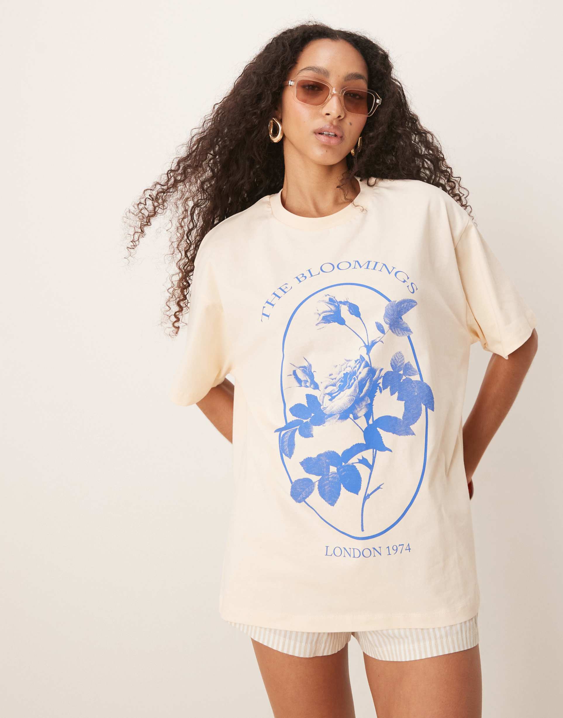 asos design oversized t-shirt with floral blooming graphic in buttermilk