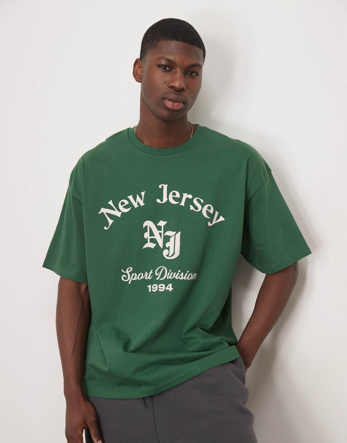 ASOS DESIGN oversized t-shirt with front city graphic in dark green