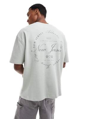Asos Design Oversized T-shirt With Front Pocket And City Back Print In Neutral