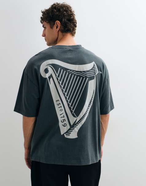ASOS DESIGN oversized t-shirt with Guinness Harp print in Charcoal - view 1