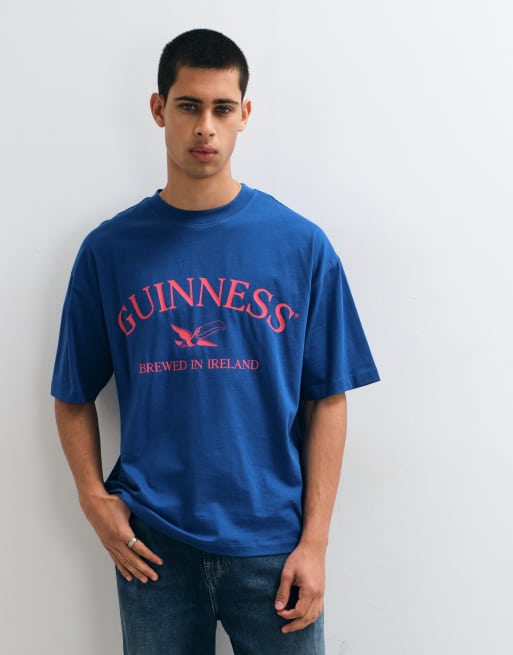 ASOS DESIGN oversized t-shirt with Guinness print in Navy, 2 of 5