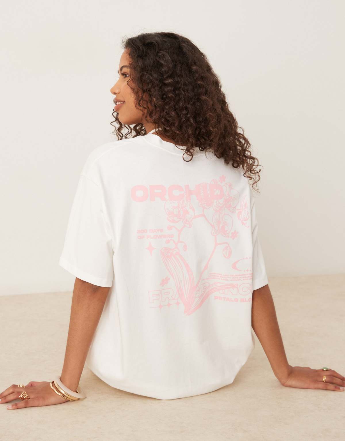 ASOS DESIGN oversized t-shirt with orchid flower back graphic in cream