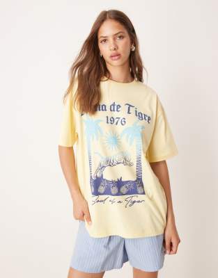 ASOS DESIGN oversized t-shirt with palm tree tiger graphic in yellow - view 1