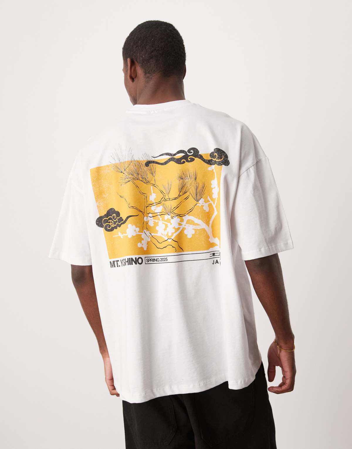 ASOS DESIGN oversized t-shirt with souvenir graphic in white