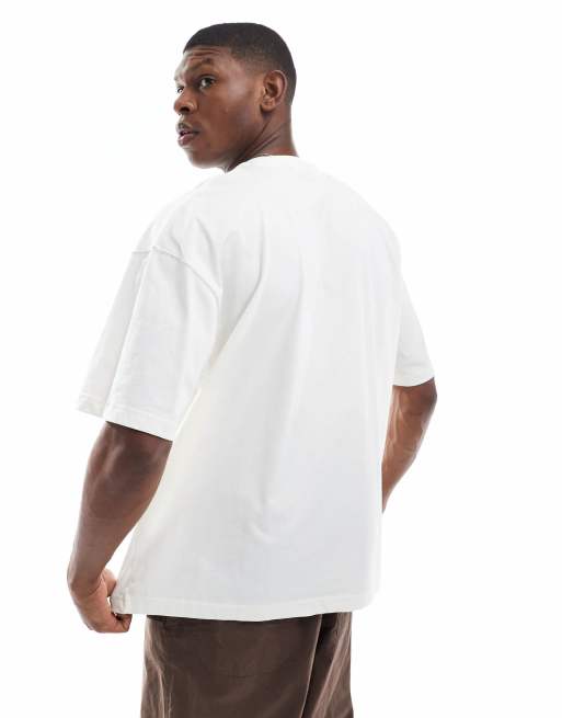 ASOS DESIGN oversized t-shirt with sports graphic in cream