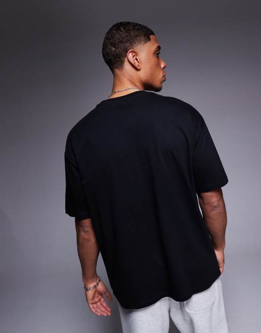 ASOS DESIGN oversized t-shirt with sports graphics in black