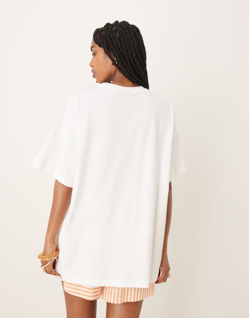 ASOS DESIGN oversized T-shirt with St Tropez graphic in cream