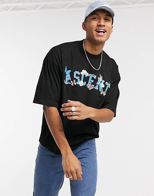 ASOS DESIGN oversized t-shirt with text and floral chest print in black ...
