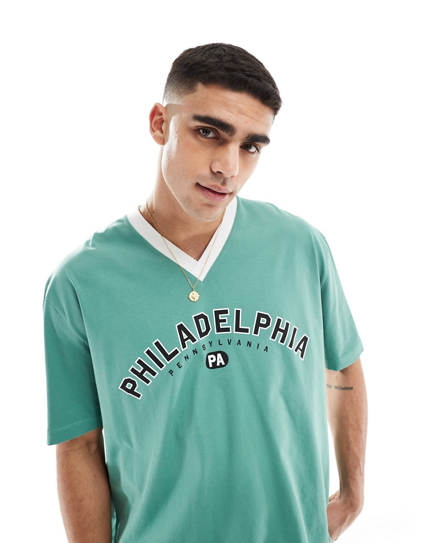 ASOS DESIGN oversized t-shirt with v-neck in green with Philadelphia print