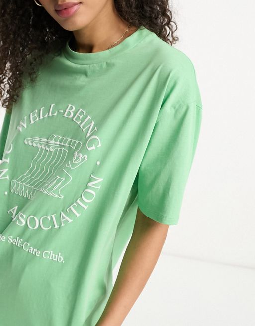 ASOS DESIGN oversized burnout T-shirt with lost vibrations graphic in green