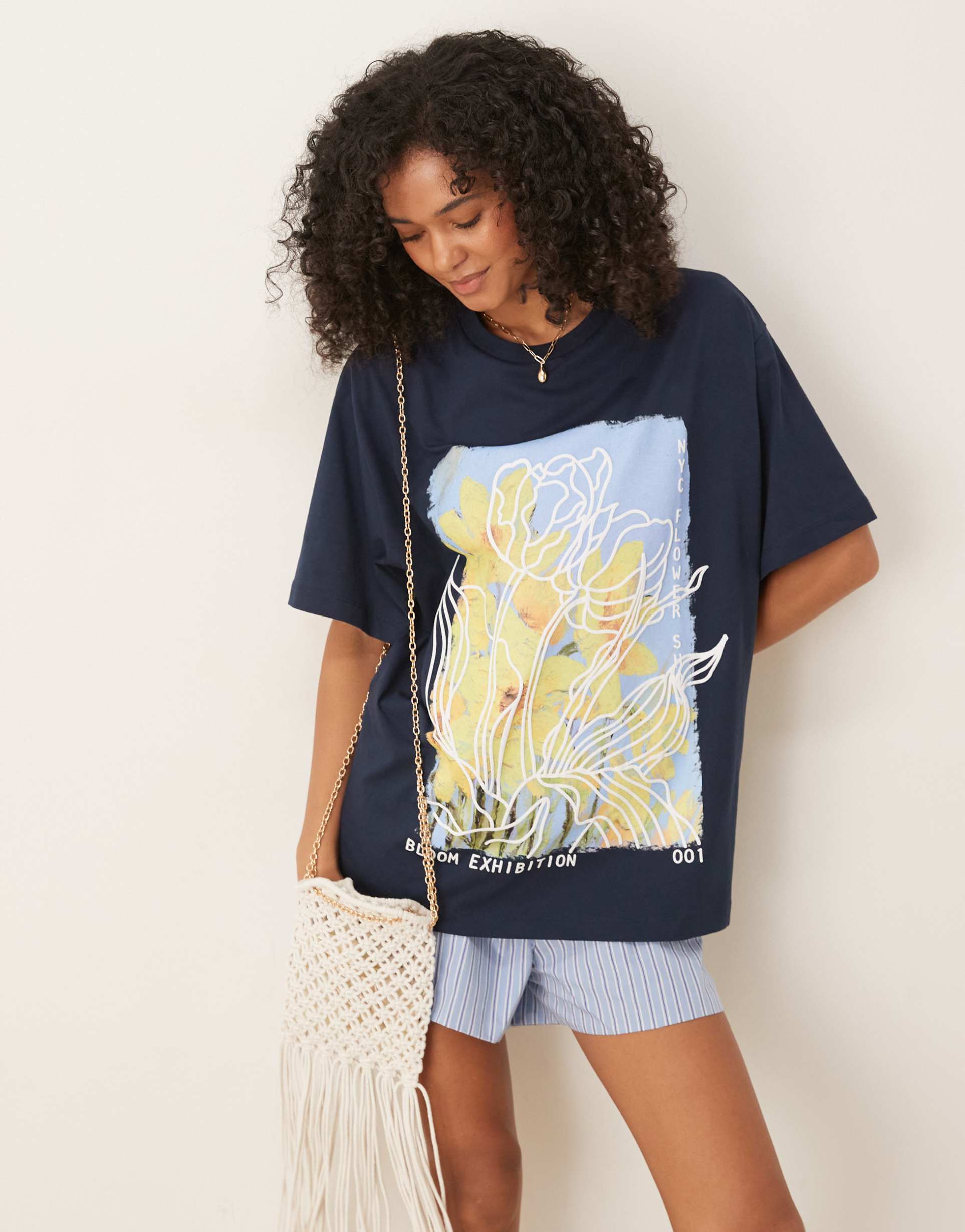asos design oversized t-shirt with yellow flower graphic in navy
