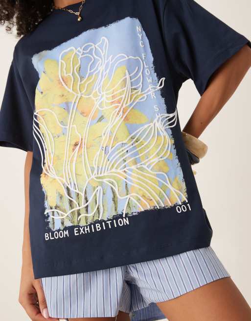 ASOS DESIGN oversized t-shirt with yellow flower graphic in navy