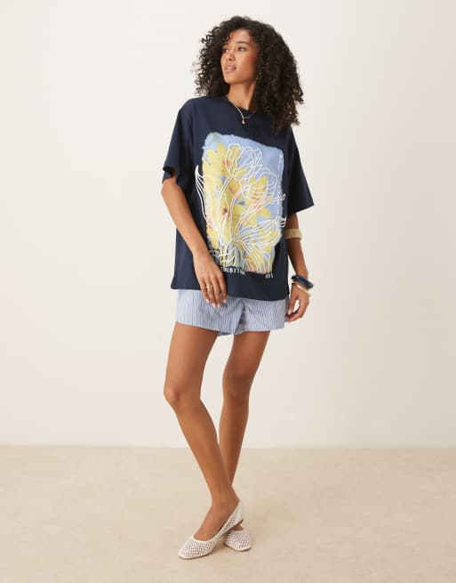 ASOS DESIGN oversized t-shirt with yellow flower graphic in navy
