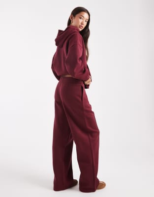 Asos Design Oversized Tailored Brushback Sweatpants With Seam Detail In Burgundy